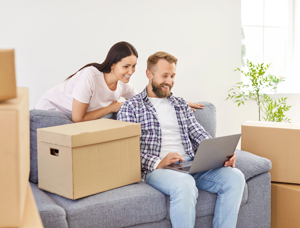 Man and woman checking on laptop
