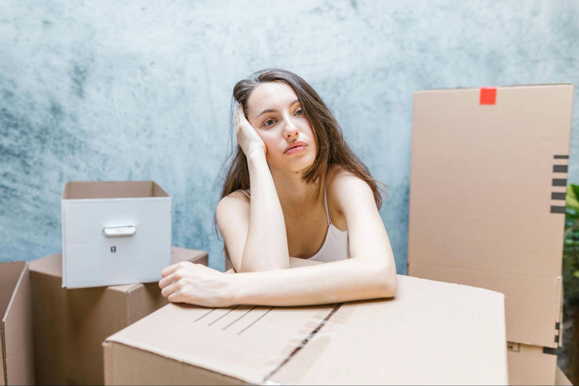 Woman resting on top of the box